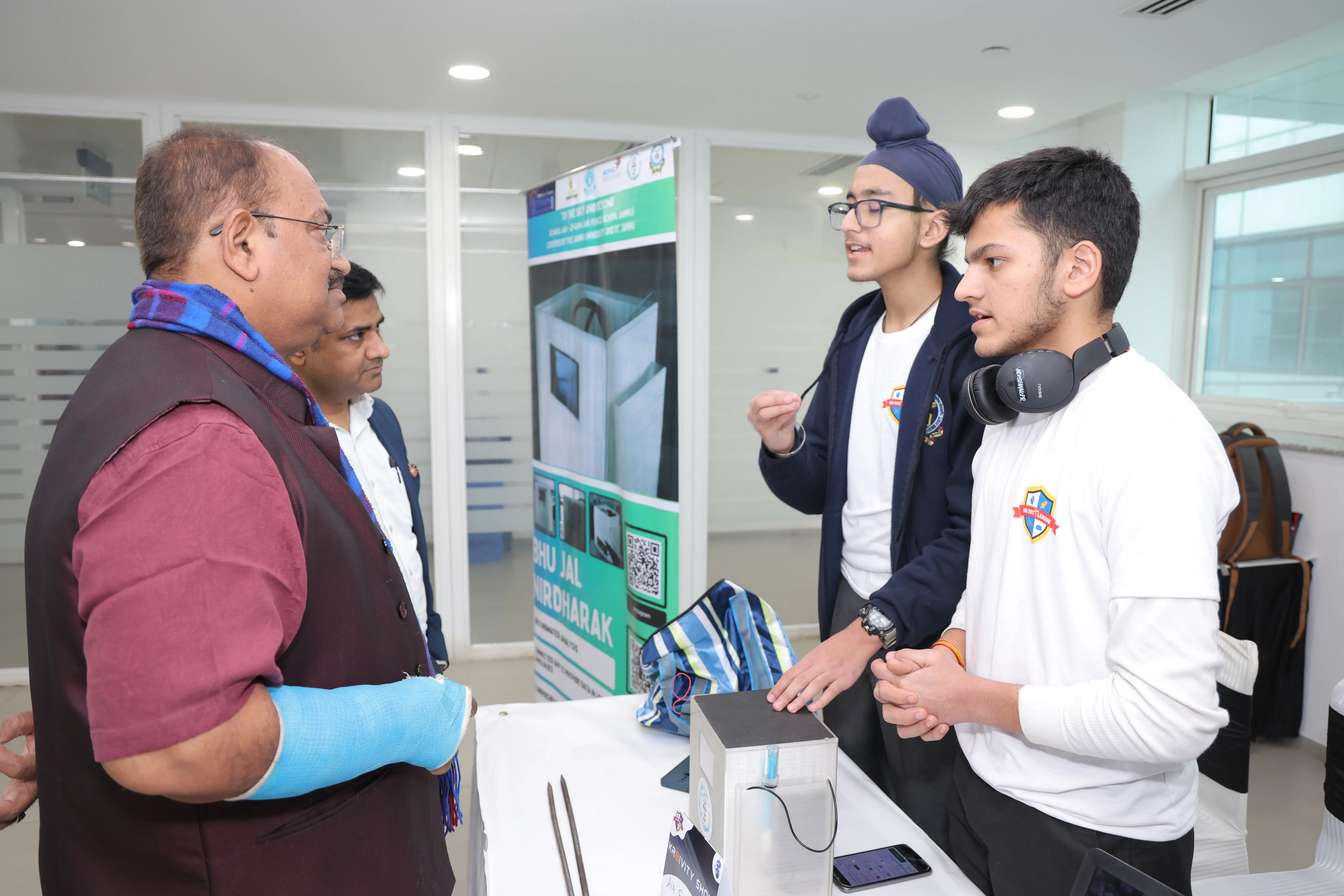 Students presenting smart project to dignitaries