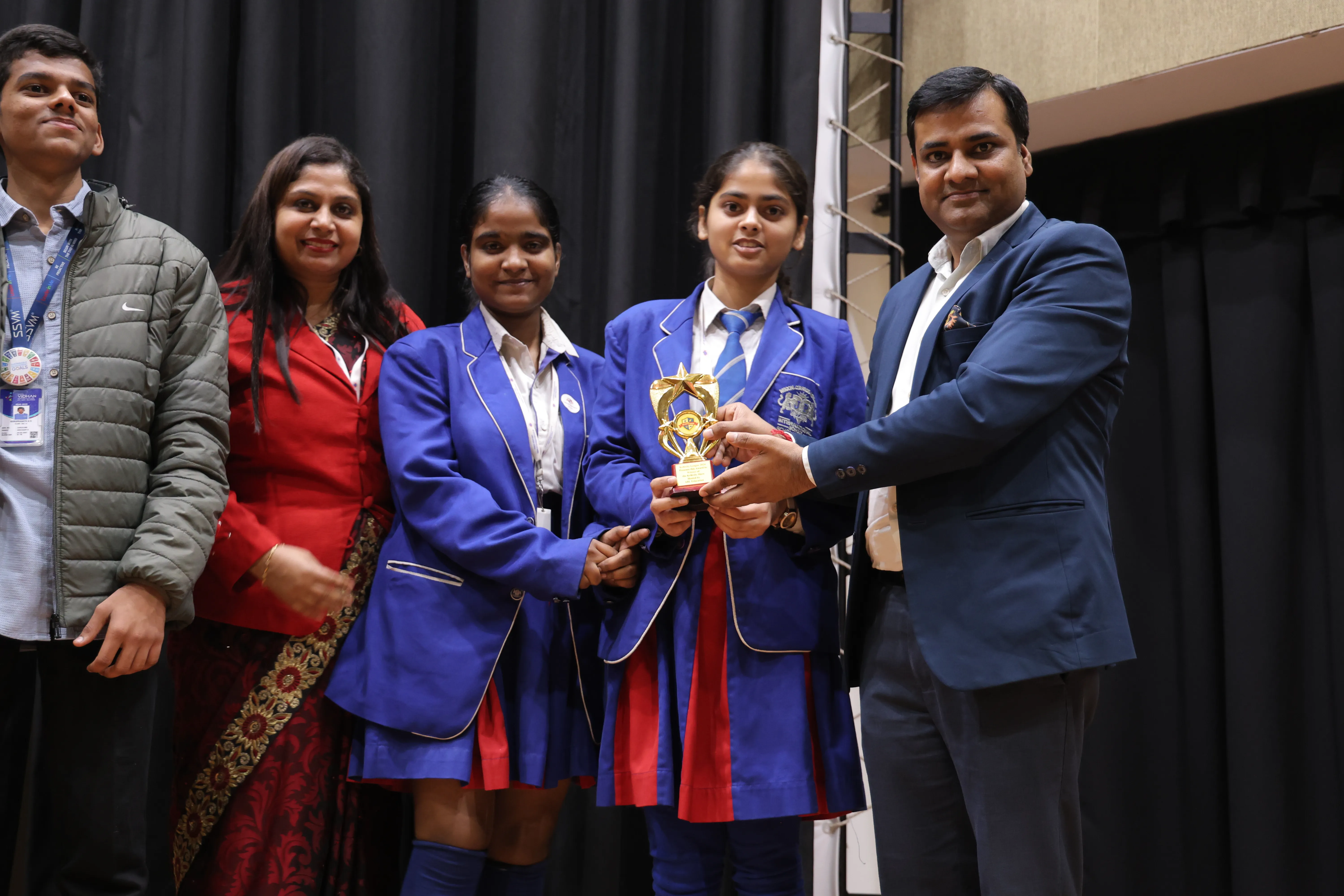 Students receiving trophy at Kreativity League